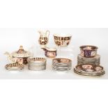 A large collection of Victorian Imari pattern teawares to include a large teapot, slop bowls,