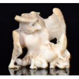 A late 19th to early 20th Century Japanese carved ivory okimono group figure of an owl and two