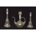 A 19th Century clear glass ewer of globe and shaft form with applied hollow blown handle and arched