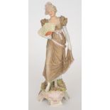 A 19th Century Continental figure of an Edwardian lady holding a feathered fan,
