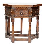 A 17th Century style carved oak credence table,