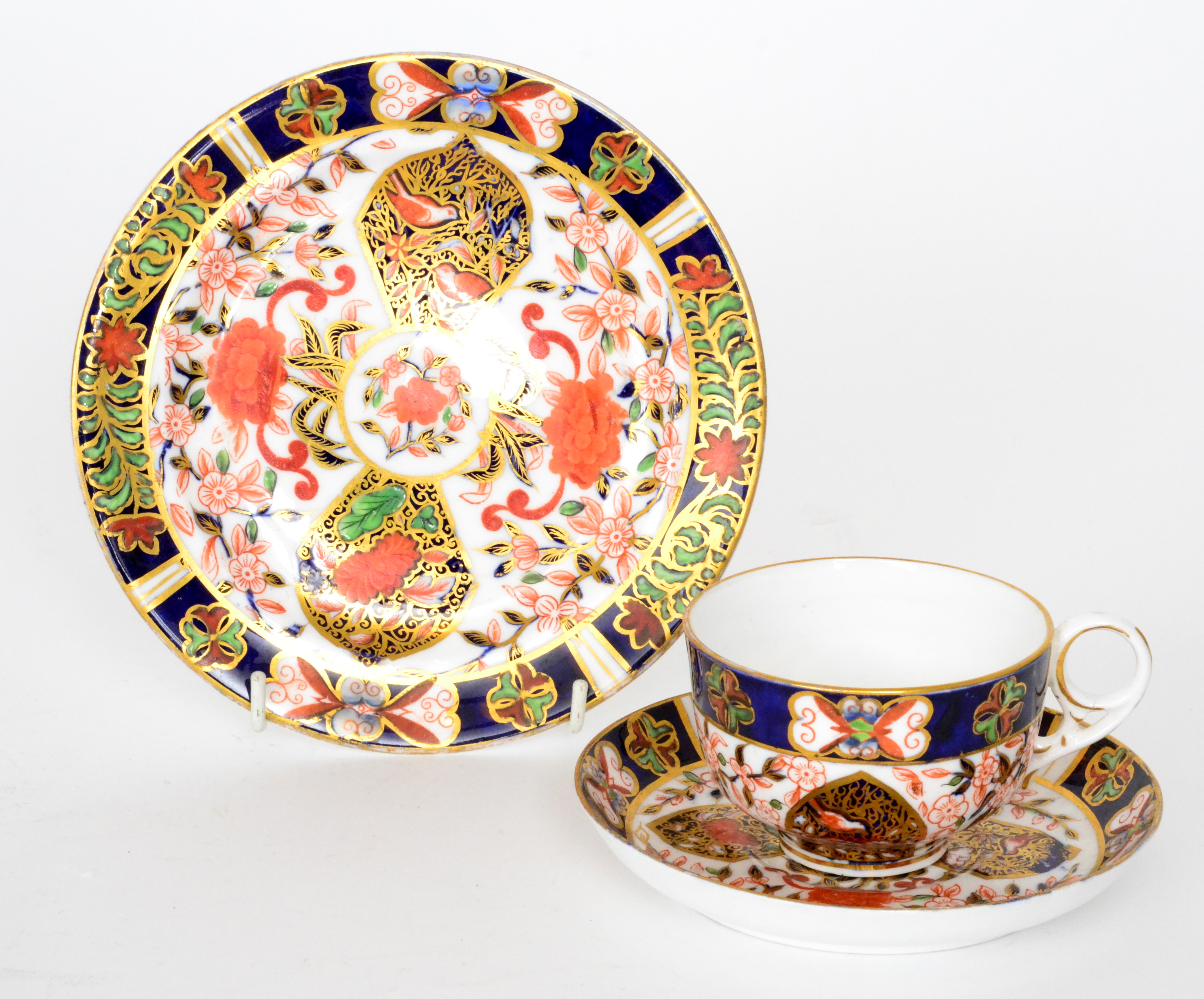 A 19th Century Derby trio decorated in the Imari palette enriched with gilded banding,