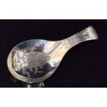 A George III hallmarked silver caddy spoon,