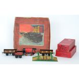 An early 20th Century boxed Hornby 0 gauge clockwork train set comprising of Loco and tender,
