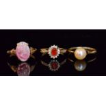 Three assorted 9ct stone set rings to include a fire opal and diamond cluster,