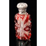 A silver mounted red overlay facet cut scent bottle of flattened shouldered form,