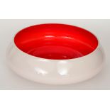 A contemporary Italian Murano glass bowl of shallow circular section cased in clear crystal over