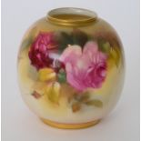 A Royal Worcester ovoid vase decorated with a hand painted crimson and pink rose to a pale ground,