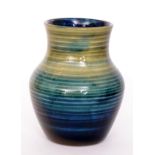 A Moorcroft 'Natural Pottery' vase of baluster form decorated in a tonal green glaze,
