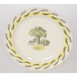 An Eric Ravilious for Wedgwood Garden pattern dinner plate decorated with a roundel of a lady sat