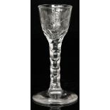 A 19th Century drinking glass in the 18th Century taste with a round funnel bowl engraved in the