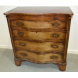 A 20th Century George III style mahogany serpentine chest of four long graduated drawers below a