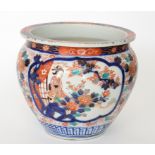 A 20th Century Japanese jardiniere decorated in the Imari palette with panel scenes of women sat