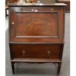 An Art Nouveau mahogany cocktail cabinet of bureau form with a concertina action divisioned