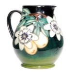 A Moorcroft Pottery jug decorated in the Passion Flower pattern, designed by Sally Tuffin,