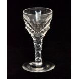 A 19th Century drinking glass in the 18th Century taste with a facet cut bowl falling to a facet