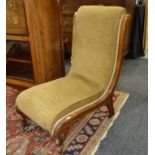 A Victorian scroll back nursing chair upholstered in floral pink design,