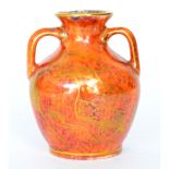 A miniature Wedgwood Portland Vase shape vase decorated in a mottled orange with gilt scholars