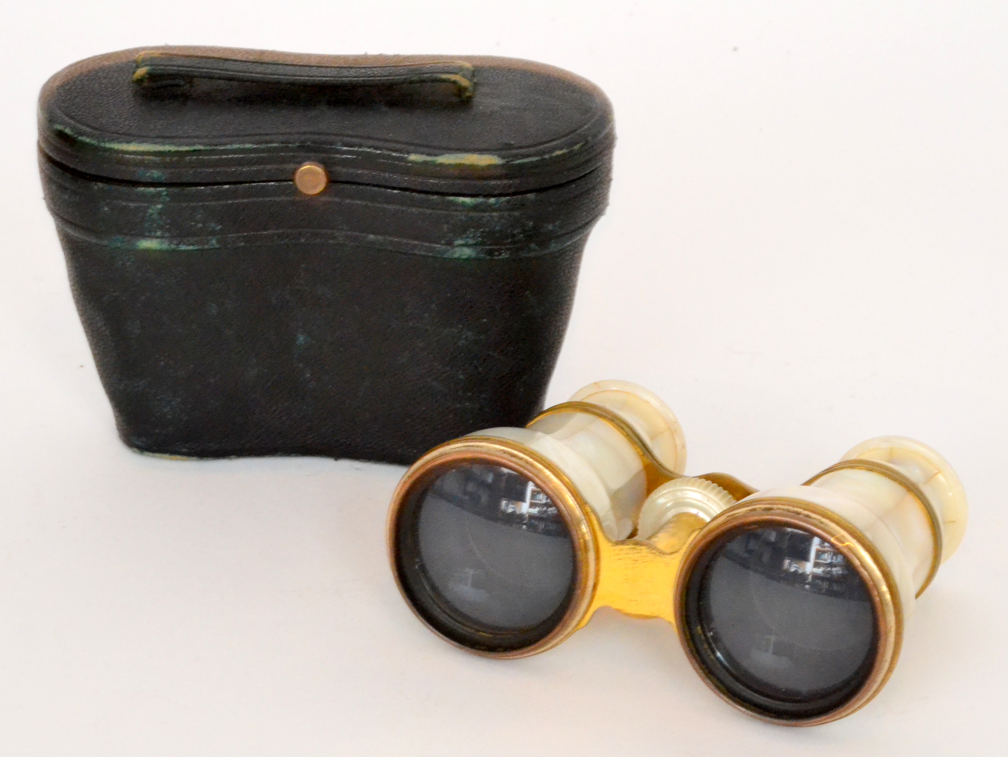 A pair of late 19th Century French mother of pearl and lacquered brass opera glasses,