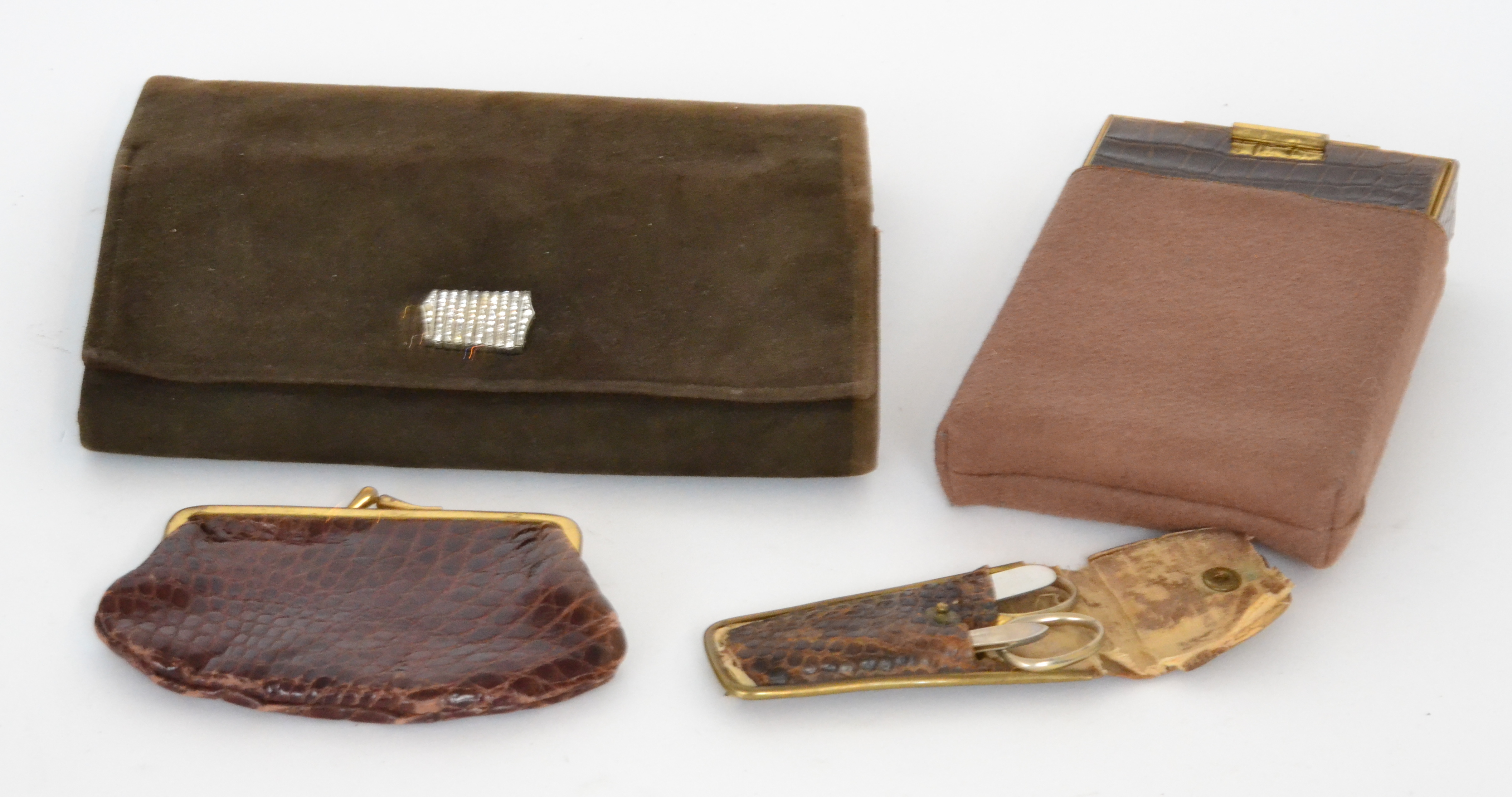 An Art Deco lady's folding compact together with a similar clutch bag containing compacts,