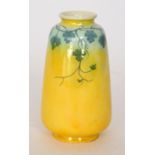 An early 20th Century Ruskin Pottery vase of tapering form decorated in a yellow lustre glaze with