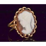 A 9ct lady's oval cameo ring carved with a figure of a girl in profile to a basket mount,