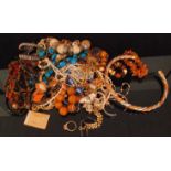 A parcel lot of costume jewellery to include a silver Pandora style charm bracelet,