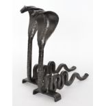 After Edgar Brandt - A pair of black painted wrought iron cobra shaped andirons,