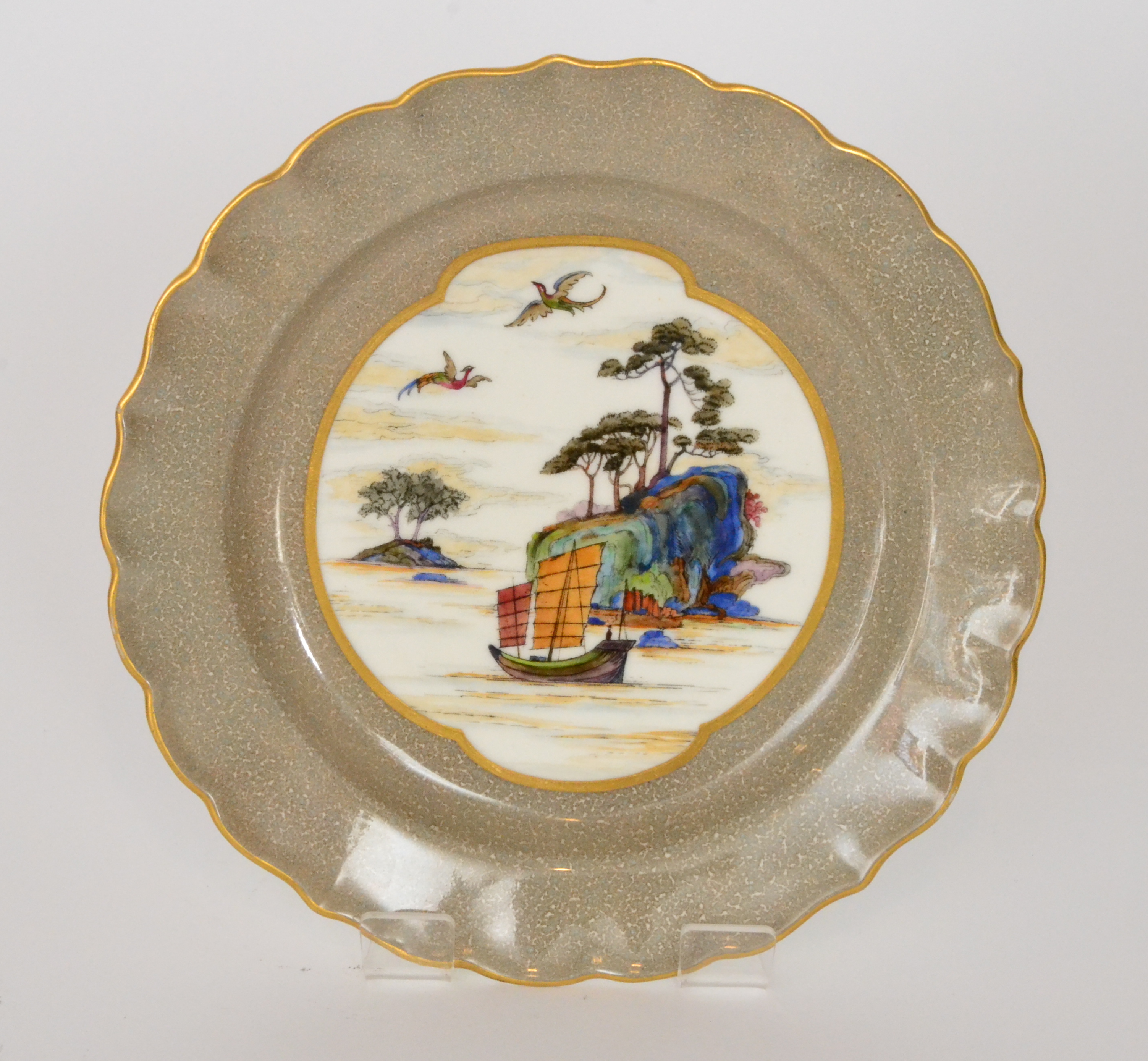 A Royal Worcester Cantonese cabinet plate decorated with a Chinoiserie seascape,