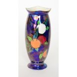 A Wiltshaw and Robinson Carlton Ware Orchard vase decorated with lustre berries against a dark blue