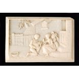 A late 19th Century Dieppe ivory panel depicting children and chicks within a yard setting,
