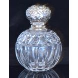 An early 20th Century hallmarked silver and cut glass scent bottle,