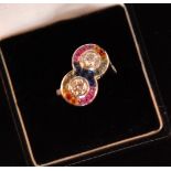 A contemporary 18ct white gold double headed multi coloured sapphire and diamond ring,