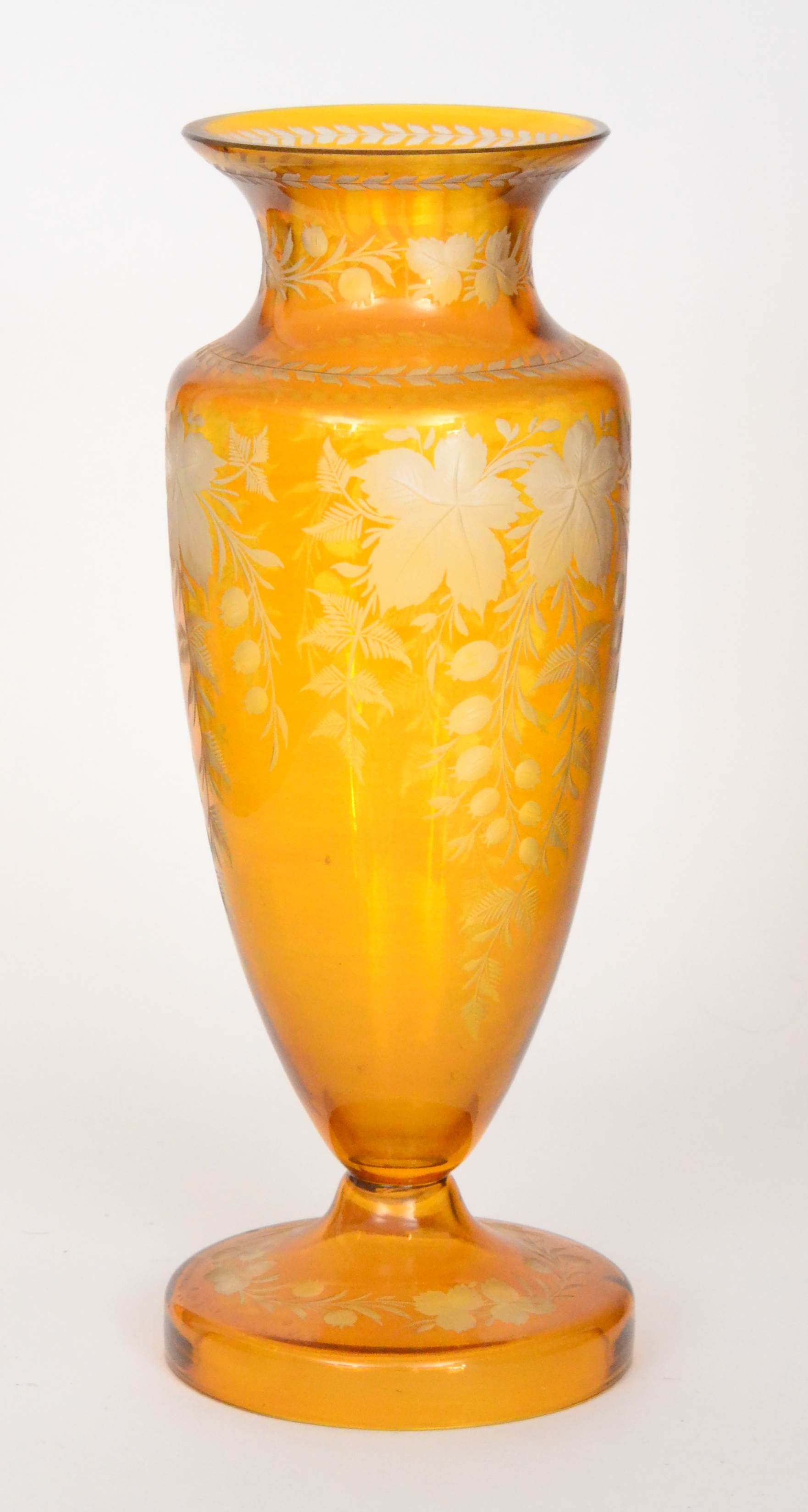 A large early 20th Century Continental glass vase, possibly Moser, with a circular spread foot,