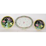 A 20th Century Chinese oval dish decorated in enamels with a border edge of bats,