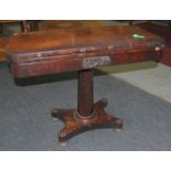 A 19th Century rosewood 'D' shape foldover card table the frieze applied with a carved floral