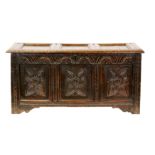 An 18th Century carved oak triple panelled front coffer,