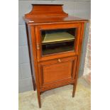 An Edwardian satinwood banded mahogany music cabinet in the Art Nouveau style enclosed by a