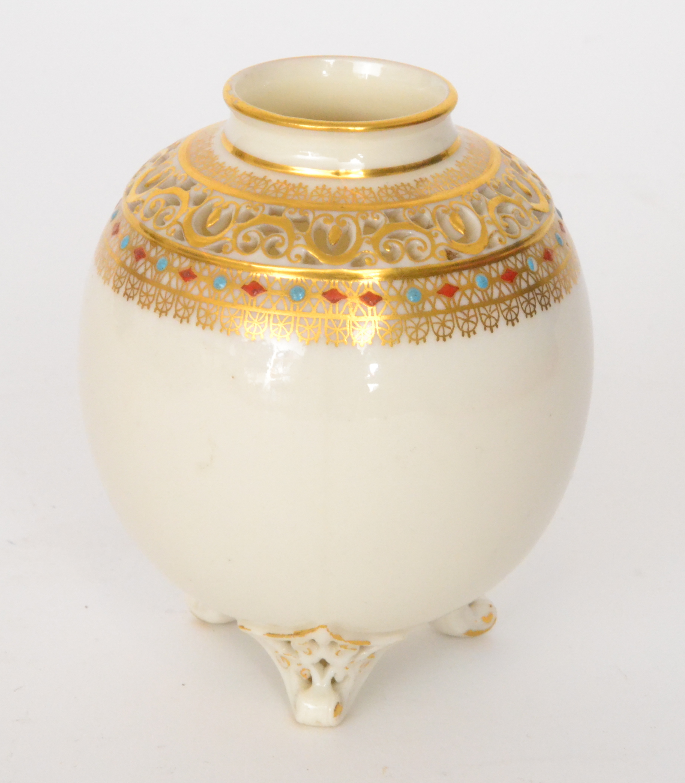 A Royal Worcester ovoid vase raised to three scroll feet,