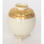 A Royal Worcester ovoid vase raised to three scroll feet,