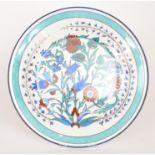 A large late 19th Century Faience charger by Choisy Le Roy of shallow dish form hand-painted in the