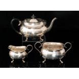 A George V hallmarked silver three piece tea service comprising of teapot,