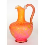 A late 19th Century Stevens & Williams Verre de Soire ewer of footed shouldered ovoid form with a