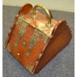 A Victorian wall and brass mounted coal box with brass shovel and applied Aesthetic style