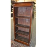 A 20th Century mahogany floorstanding open bookcase with adjustable shelves on a plinth base,