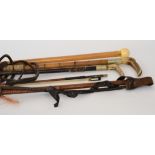 Three 19th Century horn handled leather riding crops together with an ivory ball shaped handle
