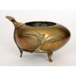A late 19th to early 20th Century Chinese polished bronze peach shaped censer raised on four strut