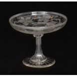 A late 19th Century clear crystal pedestal tazza with a shallow circular bowl,
