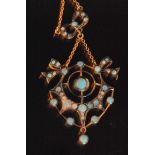 A Victorian style silver gilt opal and diamond set open work pendant detailed with stylised bows