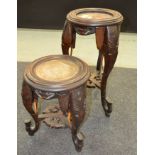 A 19th Century carved hardwood jardiniere stand inset with a marble top on elephant style shaped